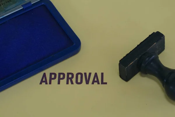 APPROVAL word with rubber stamp