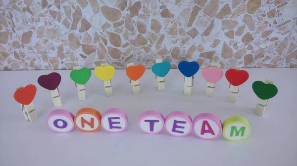 One Team Word Background Made Alphabet Printed Shape Eraser — стоковое фото