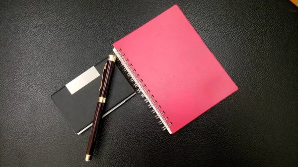 Red Diary Pen Black Background — Stock Fotó