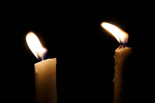 view of burning candles on dark background