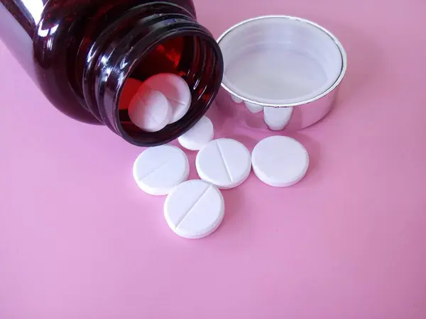 Tabletta Üveg Rózsaszín Háttér — Stock Fotó