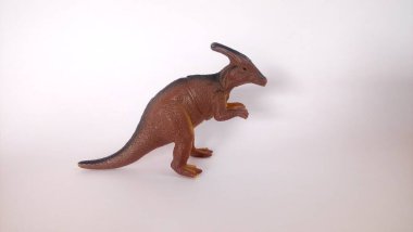 Beyaz arka planda dinozor oyuncağı