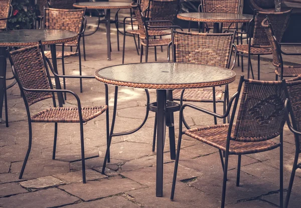 Street cafe tables and chairs in European city — Stock Photo, Image