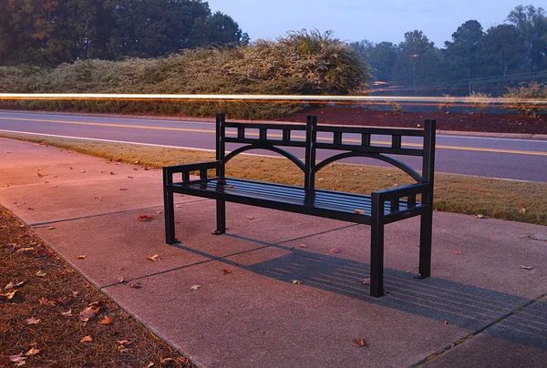 Bench near the road — Stock Photo, Image