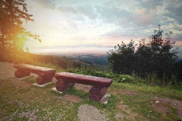 Vintage photo of bench at the mountains — Stock Photo, Image