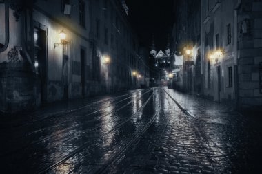 Rainy night in old European city clipart