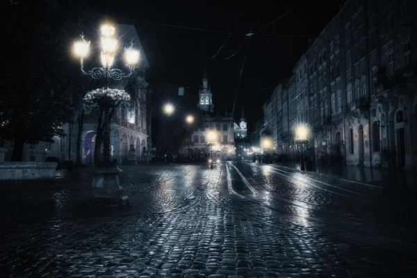 Old European city at rainy night — Stock Photo, Image