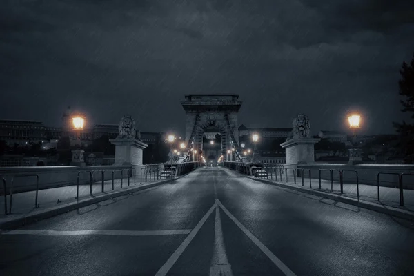 Old bridge at rainy night — Stock Photo, Image