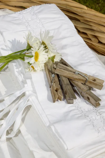 Basket full of clean freshly washed grandmother's linens — Stock Photo, Image