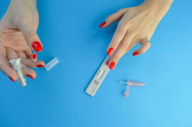 testing for coronavirus. determination of IgG and IgM antibodies. puncture of a finger with a lancet, identifying a disease in the body. infection test.