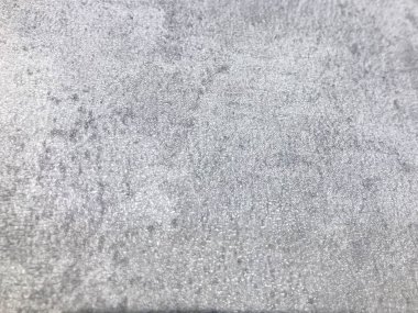 Gri doku. Beton doku. Doku koyu gri bir boyayla boyanmış. Beton yolun dokusu. Hacimli, kabartmalı koyu arkaplan.