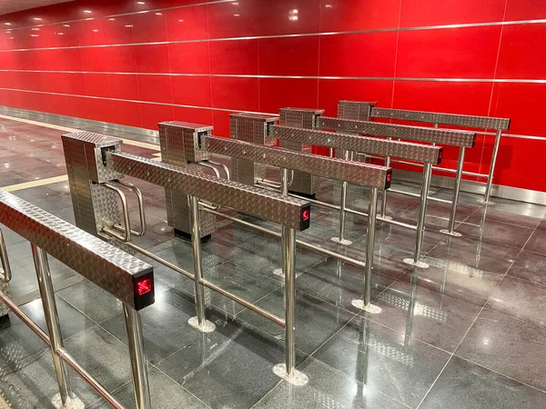 Automatic barriers for control people entered in railway station or in metro, red light show for no entrance, necessary tickets, new technologies in habitual life, automatic open and close doors.