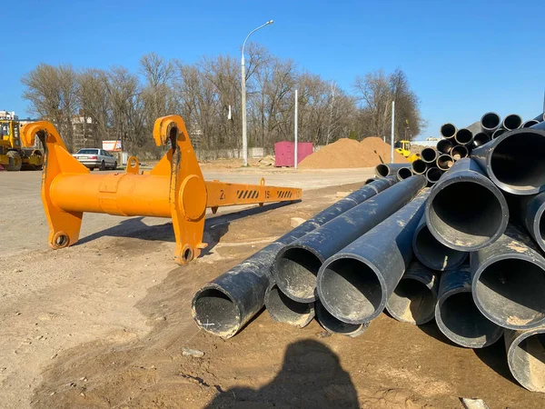 Modern polypropylene pipes for conducting heating mains underground. Close-up photo during sewer construction works.