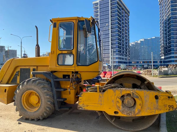 Background of asphalt roller that stack and press hot asphalt. Road repair machine.