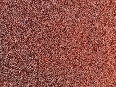 Spor parkının güvenli kapağının yumuşak kauçuk yüzeyinin kırmızı dokusu baskılı ince kauçuktan yapılmıştır. Arka plan. Doku.