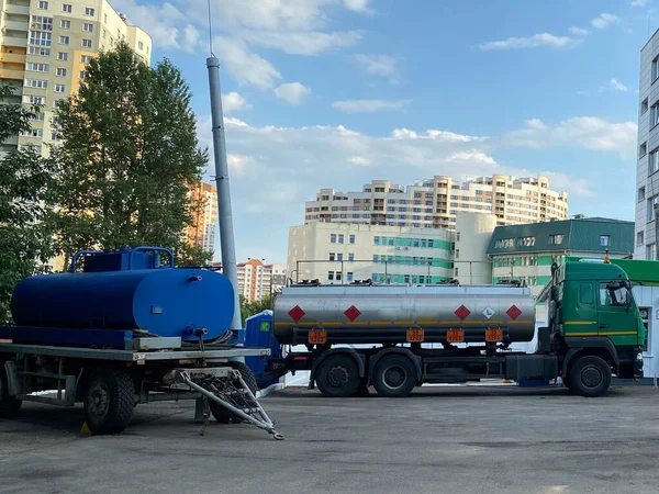 Large industrial truck with a tank, a fuel tanker at a gas station for the transportation of fuel oil, gasoline and diesel.