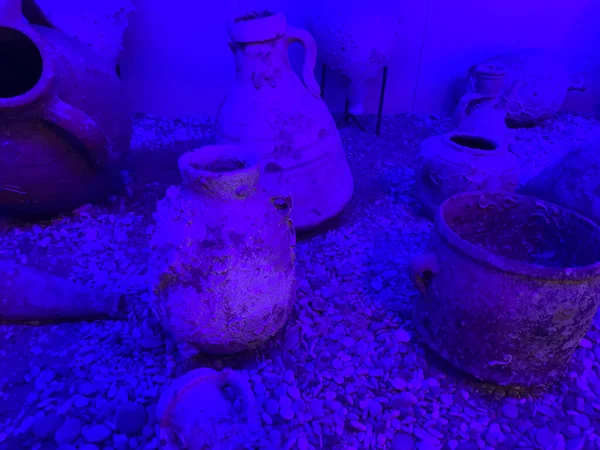 Decorative under water tank with broken jar.