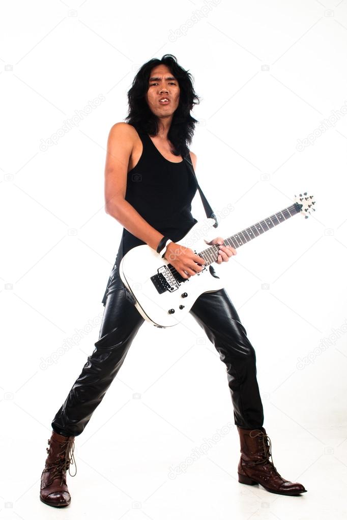 Long hair rock n roll guy playing guitar