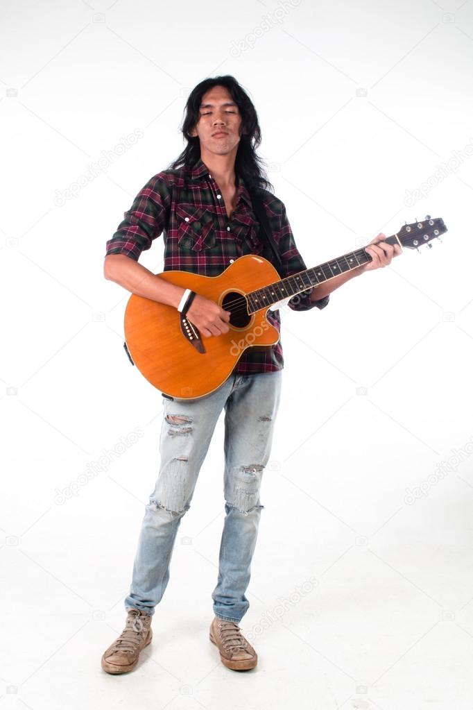 Long hair guy playing guitar acoustic Stock Photo by ©ragakawaw 65501857