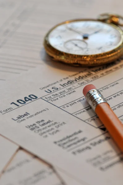 Tax form and old hand watch — Stock Photo, Image