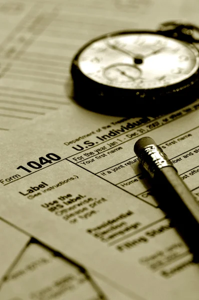 Tax form and old hand watch — Stock Photo, Image