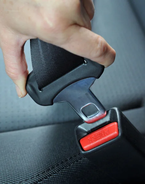 Hand button seat belt — Stock Photo, Image