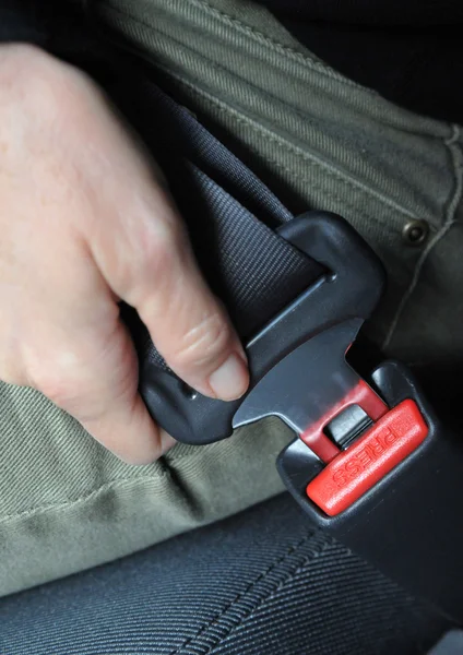 Hand button seat belt — Stock Photo, Image