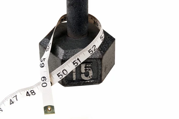 Dumbbell and measuring  tape — Stock Photo, Image