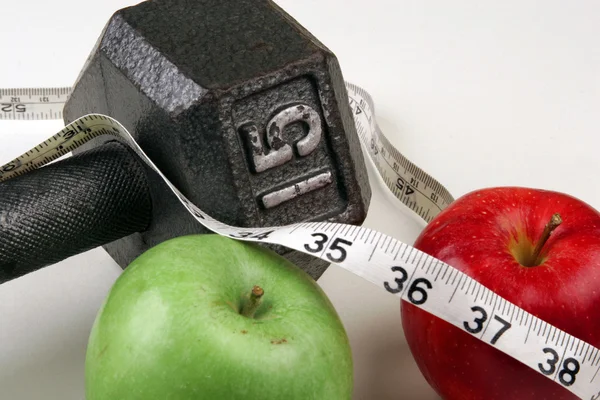 Dumbbell and measuring  tape — Stock Photo, Image