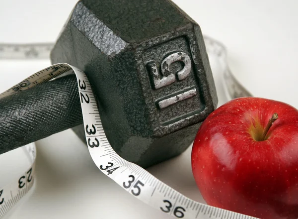 Dumbbell and measuring  tape — Stock Photo, Image