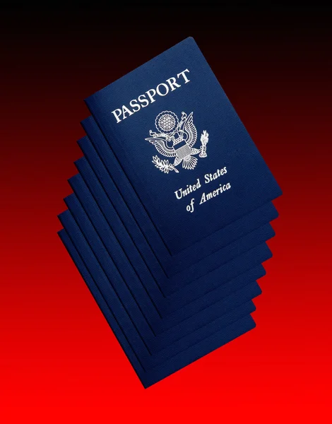 Pasaportes americanos sobre negro y rojo —  Fotos de Stock