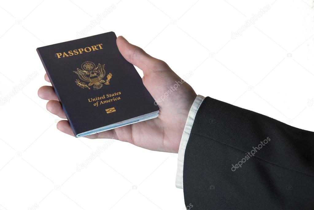 Hand holding an American Passport