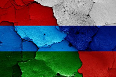flags of Karelia and Russia painted on cracked wall