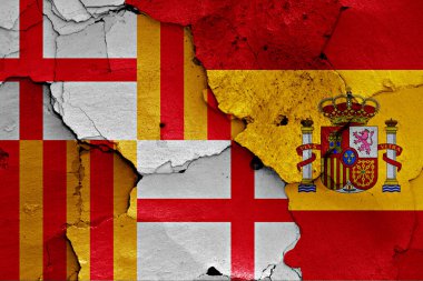 flags of Barcelona and Spain painted on cracked wall