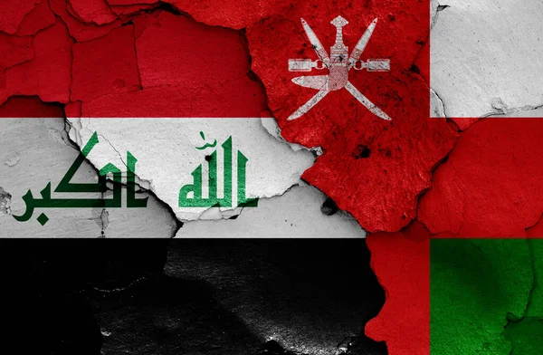 Flaggen Des Irak Und Des Oman Auf Rissige Wand Gemalt — Stockfoto
