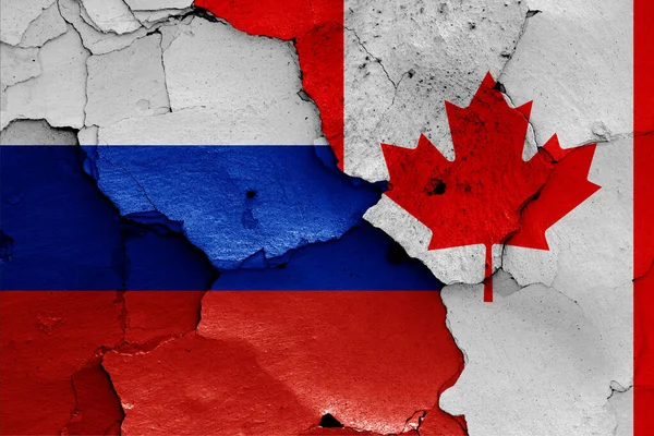Vlaggen Van Rusland Canada Geschilderd Gebarsten Muur — Stockfoto