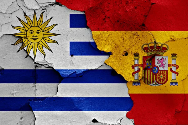 Flags Uruguay Spain Painted Cracked Wall — Stock Photo, Image