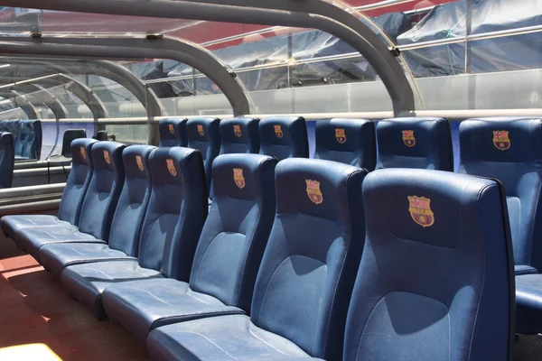 BARCELONA, SPAIN - JUNE 12, 2011: Blue reserve players seats with symbols on Camp Nou Stadium in Barcelona. Camp Nou is the home arena for FC Barcelona and seats 99786 people