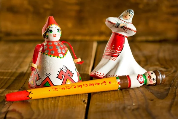 MOSCOW, RUSSIA - FEBRUARY 18, 2015: Souvenirs from Chuvashia. Dolls in folk costumes on wooden background — Stock Photo, Image