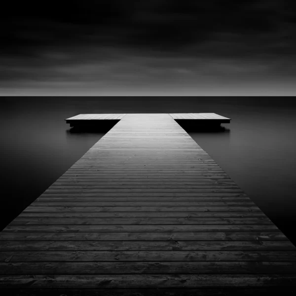 Jetty on a lake in Bavaria, Germany, long time exposure — Stock Photo, Image