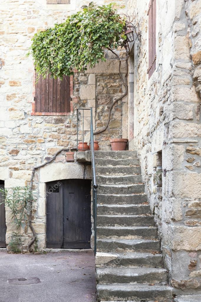 Picturesque stairs in the village of Vinezac, France