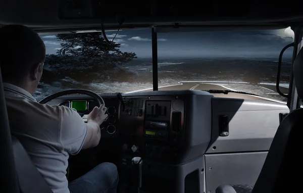 The truck driver on the night road. business trip — Stock Photo, Image