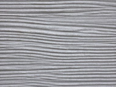 Soyut dekoratif arkaplan, tekrarlanan desenli dokulu bir malzeme yüzeyi gösteriyor. Grafik tasarımı, yaratıcı projeler, ambalaj, reklam ve görsel düzenler için nötr arkaplan.