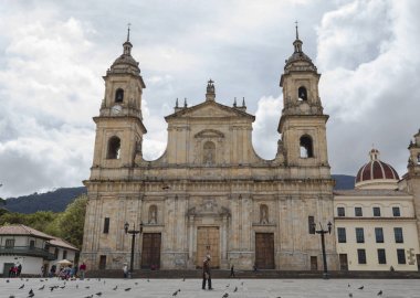 BOGOTA, COLOMBIA - Primatial Cathedral at bolivar square with cloudy sunny day at background clipart