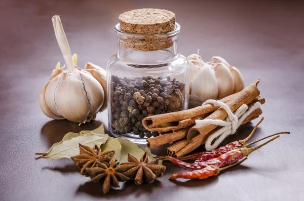 Jar and collection of spices — Stock Photo, Image