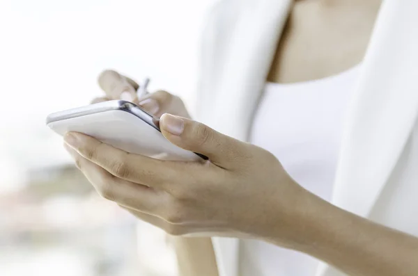 A woman using tablet with stylus pen — Stock Photo, Image