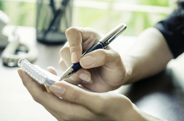 A woman noting — Stock Photo, Image