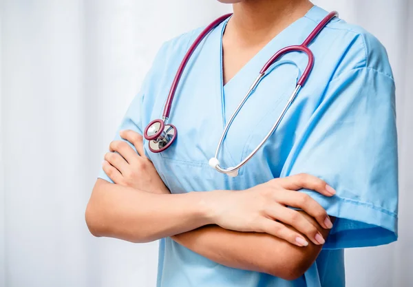 Doctor listening to patient heart — Stock Photo, Image