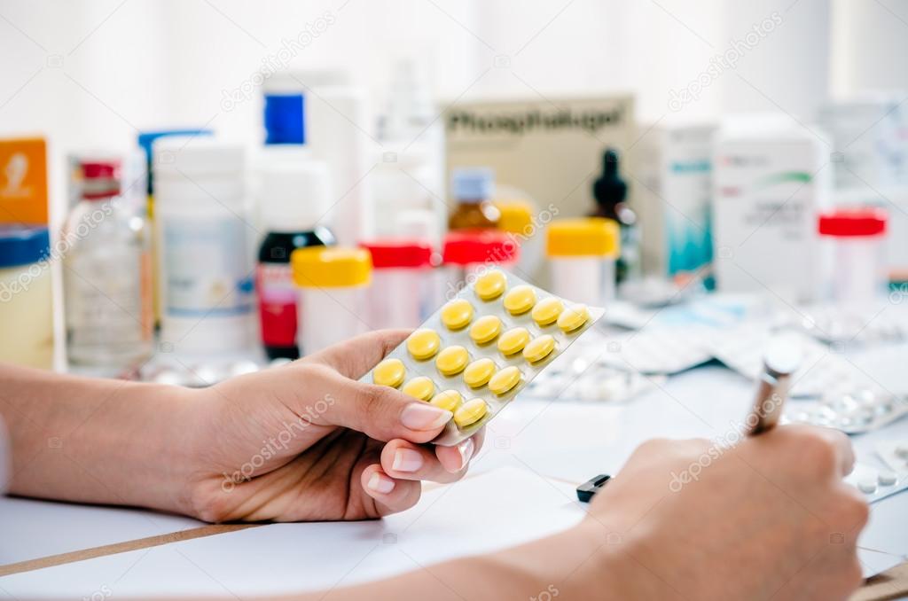 pharmacist writing a prescription