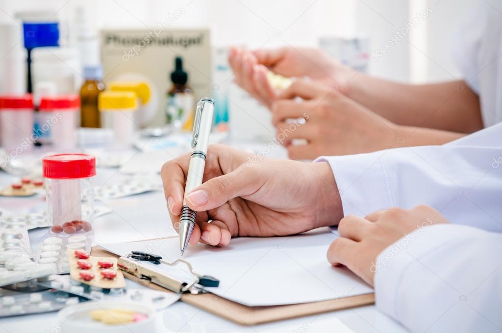 pharmacists working in office